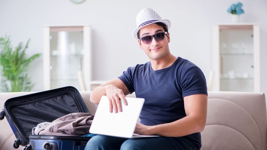Man completing a Maxi Taxi booking online